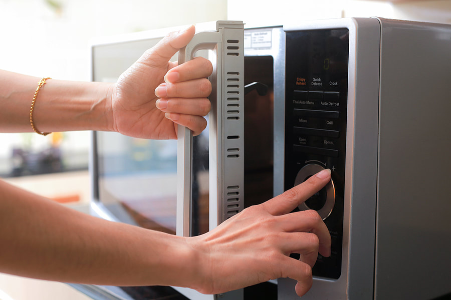 woman using a microwave